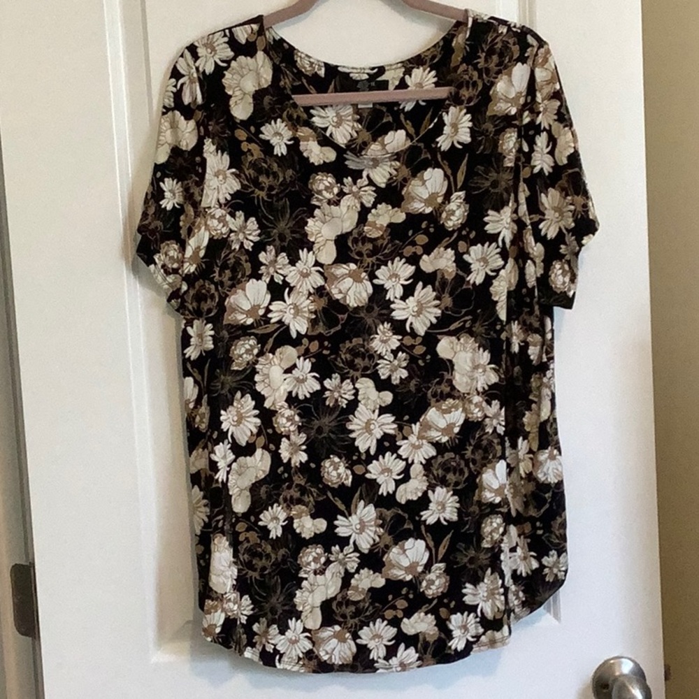 Black background with beige and tan flowers